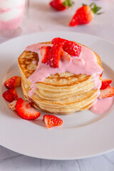 Strawberry pancakes on a white background.