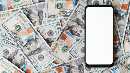 Smartphone mockup, mobile phone with white screen lying on one hundred dollar bills money...