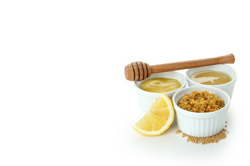 Bowls with sauces isolated on white background