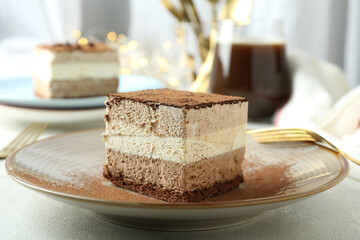 Concept of tasty dessert with Tiramisu cake, close up