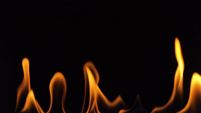 Real fire flames on black background suitable for post production