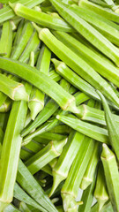 okra or okro, also known as ladies' fingers, vegetable background, closeup taken in shallow depth of field