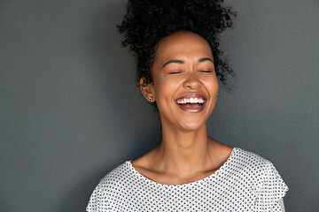 Black carefree woman laughing