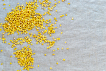 golden beans, dehusked green beans, split up mung bean on fabric background, peeled mung bean background.