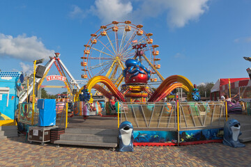 Attractions in the amusement park Avangard on Lenin Avenue in the resort city of Evpatoria, Crimea