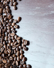 Coffee grains on a wooden table