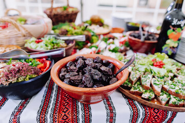 Ukrainian buffet table. Impressive buffet in the wedding hall. Cossack table. Buffet with moonshine for men.