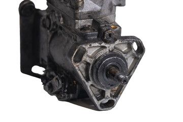 Old and worn diesel car high pressure pump on a white background. Automotive diesel pump, mechanical, from older type car. Drive belt view.