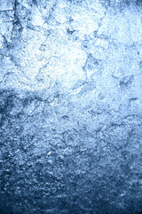 Fototapeta na wymiar Texture with large strokes. The texture is translucent ice. Light breaks through the blue ice. The texture of the ice floe