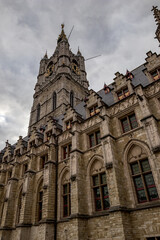 Fototapeta premium Moody daytime travel photograph from the historical center of Gent, Belgium. Cloudy sky.