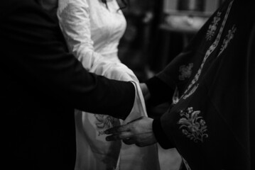Naklejka premium The bride and groom during the wedding ceremony. Church wedding.