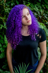 Portrait of young lady with purple hair.