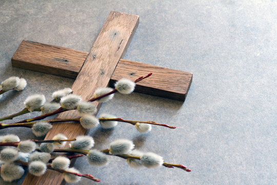 Easter wooden cross with catkins, palm sunday religious concept abstract