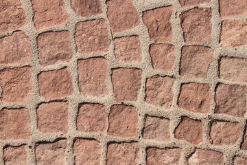 Close up of a red cobblestone walkway