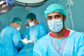 Surgeon during emergency surgical intervention in clinic