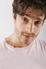 Fototapeta premium Emotional portrait of a handsome guy with an athletic figure 
