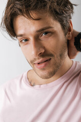 Obraz premium Emotional portrait of a handsome guy with an athletic figure 