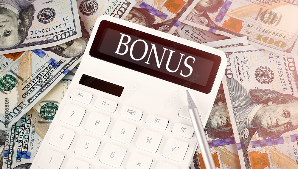 Poster bonus text on display calculator on dollars background