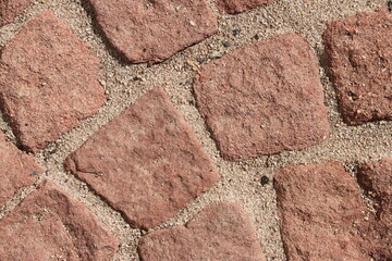 Close up of a red cobblestone walkway