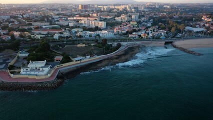 Obraz premium santo amaro in a huge sunset over ocean seeing the city
