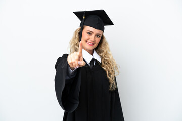 Young university graduate woman isolated on white background showing and lifting a finger