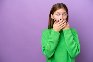 Young English woman isolated on purple background covering mouth with hands
