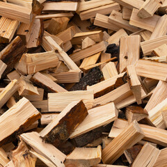 Chopped wood texture. flat logs piled in a heap