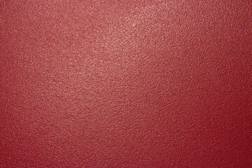 The texture of the red matte plastic.Red matte background.The background is red rough plastic.