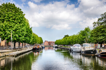 Fototapeta na wymiar Boats docked on the Bruges canal