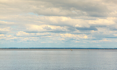 beautiful landscape of the sea against the background of a blue sky with clouds