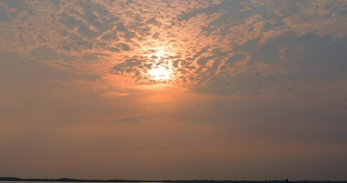 4K Timelapse sunset ,landscape Amazing light of nature cloudscape sky and Clouds moving away rolling 4k colorful