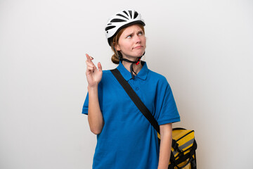 Young English woman with thermal backpack isolated on white background with fingers crossing and wishing the best