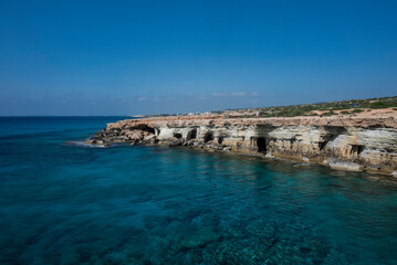 coast in ayia napa sea caves in cape greco in cyprus on the seashore with rocks