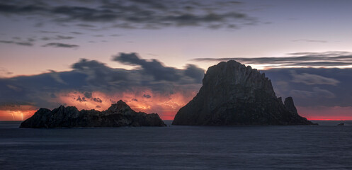 Es Vedra Island after sunset with lightnings , Ibiza 