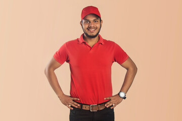 Confident Delivery Man Wear Red Outfit Smiling Hands Arms Waist Isolated Color Color Background