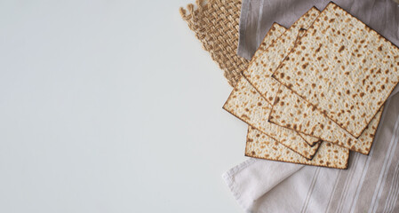 Layout of  Traditional Matzah prepared for Passover on white background. Spring Holiday of Jewish people. top view.  Fasting time. Space for text.