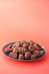 dark chocolate on a plat red background 