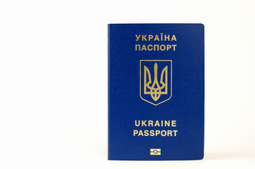 Ukrainian passport on a white background, selective focus. Inscription in Ukrainian Ukraine Passport