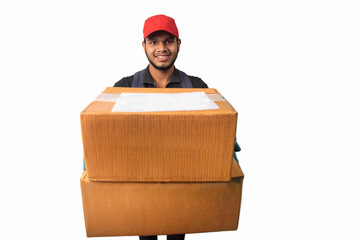 Portrait Of Young Delivery Man Holding Cardboard Box Against White Background