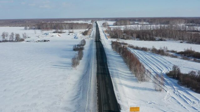 Trans-Siberian highway. Traffic on the Omsk - Novosibirsk AH6 "Irtysh" highway. Aerial view.