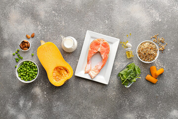 Set of healthy products with pills on grunge background