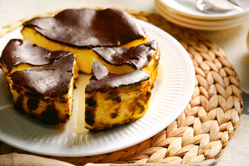 Tasty Basque burnt cheesecake on table