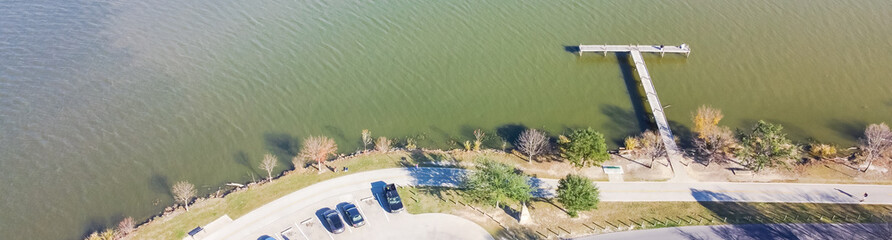 Panoramic aerial view fishing dock jetty with fishermen anglers on White Rock Lake near Dallas...