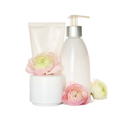 Set of cosmetic products and beautiful ranunculus flowers on white background
