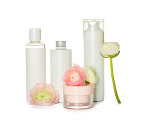 Obraz na płótnie Canvas Set of cosmetic products and ranunculus flowers isolated on white background