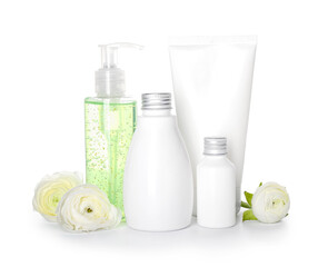 Set of cosmetic products and ranunculus flowers isolated on white background