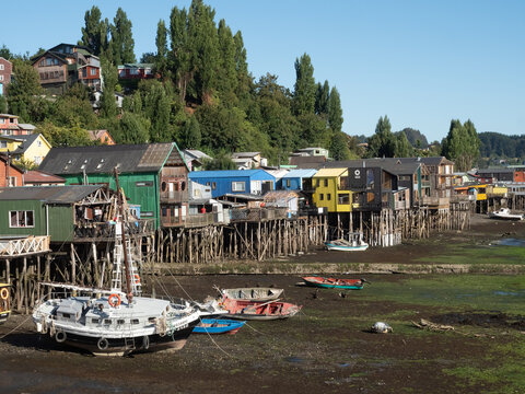 Fascinatinhg stilt houses (palafitos) on the fjord shores of the city of Castro, Chiloe Island, Chile
