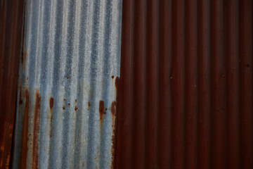 Rusty silver metal texture with old corrugated zinc sheet wall or roof pattern texture. Roofing industry metal background