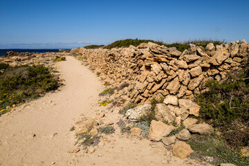 path next to stone wall, Cap Salines beach, Mallorca, Balearic Islands, Spain