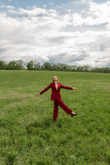 Fashion portrait of a beautiful and cute girl in nature in stylish clothes